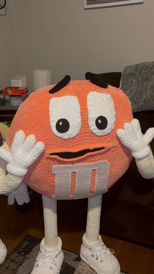 Orange M&M standing character